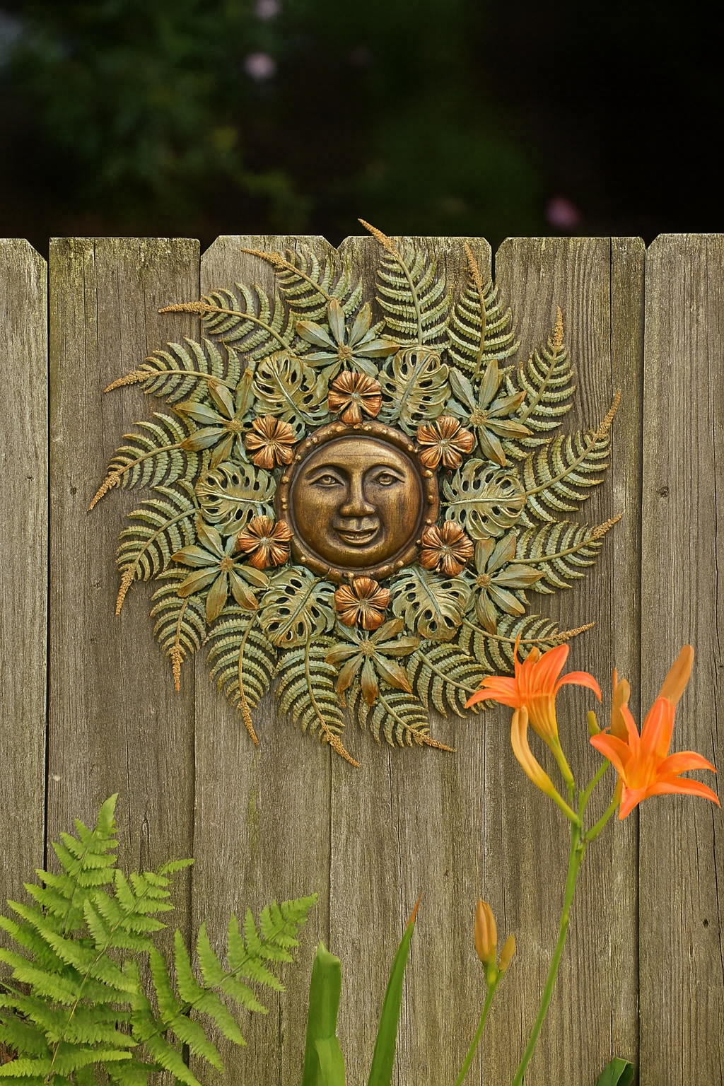 Sun wall decor in garden.png