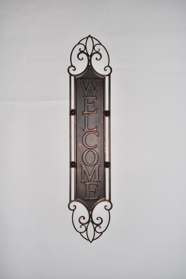Verticle Metal Welcome Sign on fence.png